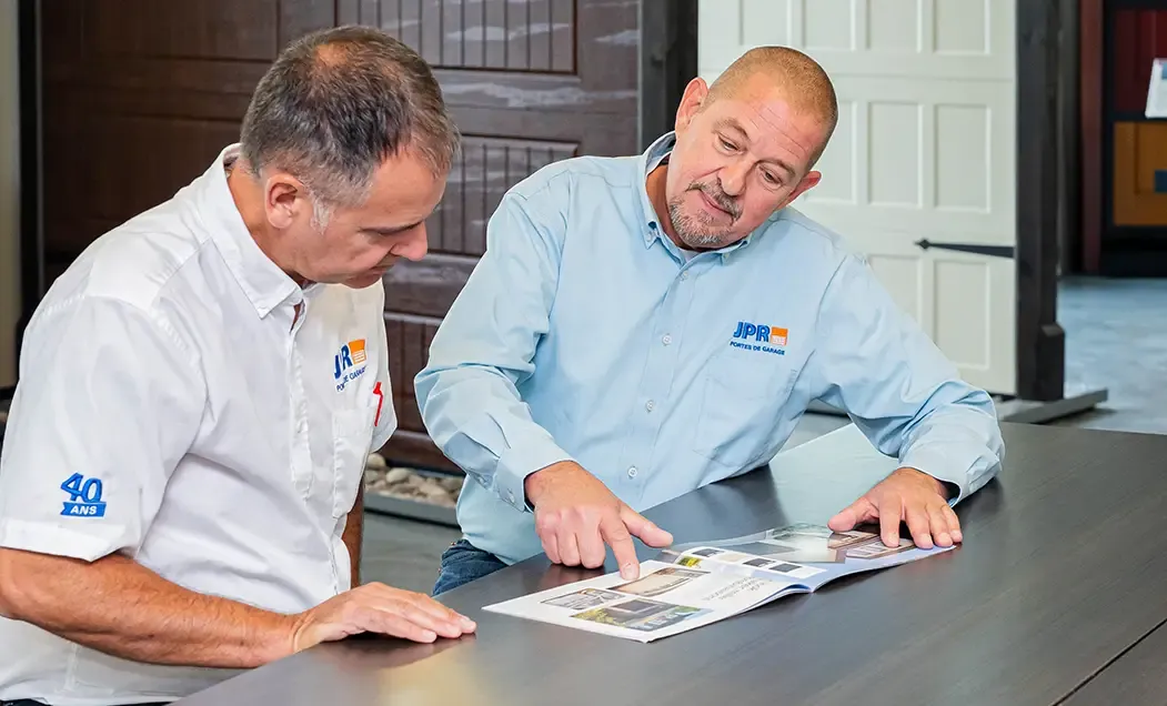 Two men looking at a brochure