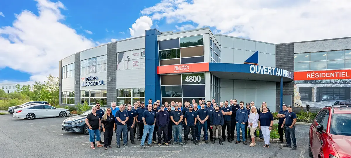 Team photo in front of the company building.